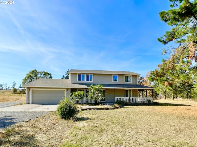 view of front facade with a porch and a garage