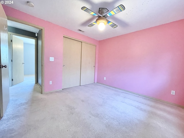 unfurnished bedroom featuring a closet and ceiling fan