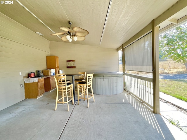 view of patio featuring ceiling fan