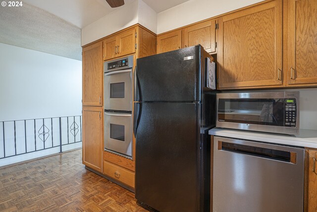 kitchen featuring light countertops, stainless steel appliances, and brown cabinetry