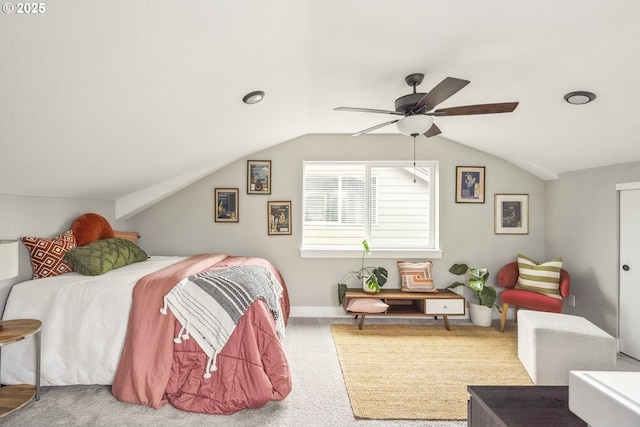 carpeted bedroom with baseboards, lofted ceiling, and ceiling fan