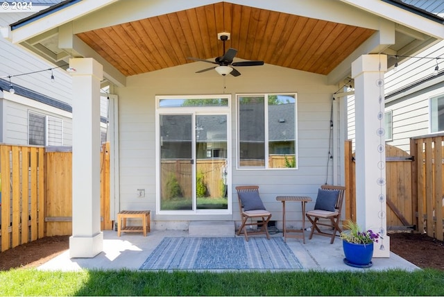 view of patio / terrace with a ceiling fan and fence