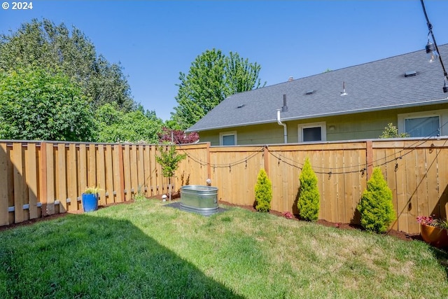 view of yard with a fenced backyard