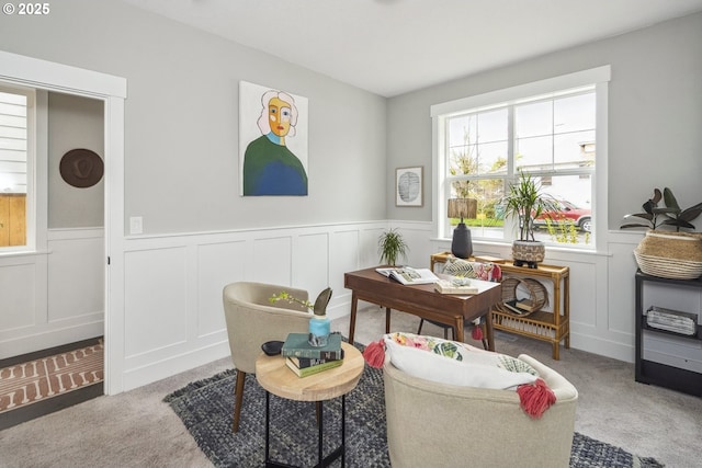 carpeted office with a wainscoted wall