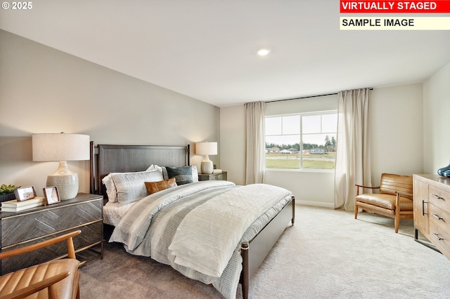 bedroom featuring baseboards and light carpet