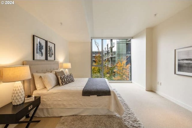 carpeted bedroom with baseboards