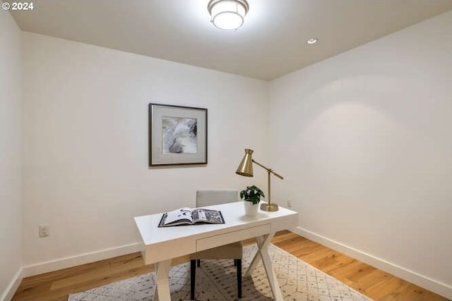 office with baseboards and wood finished floors