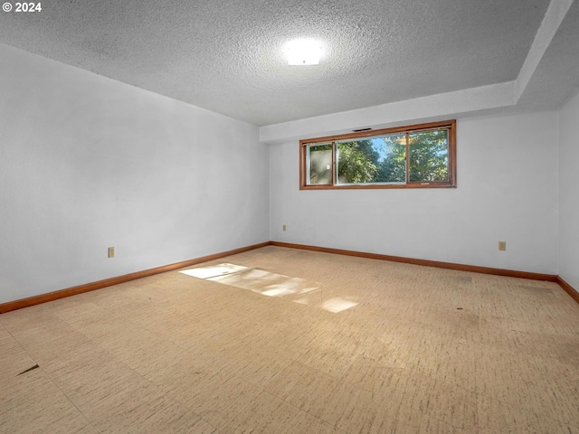 spare room featuring a textured ceiling