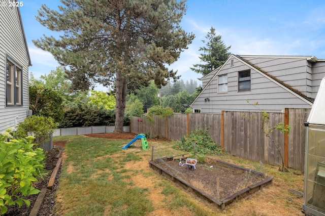 8413 SW 4th Ave, Portland, OR 97219 - fenced backyard with a vegetable garden