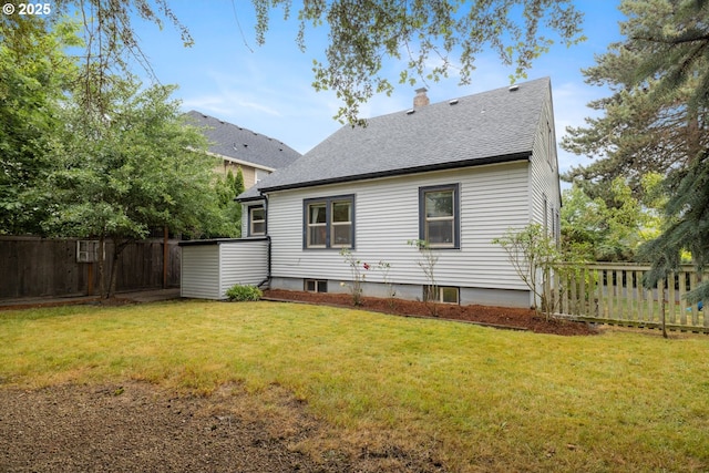 8413 SW 4th Ave, Portland, OR 97219 - rear view of house with a fenced backyard, roof with shingles, and a chimney