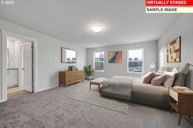 carpeted bedroom with connected bathroom