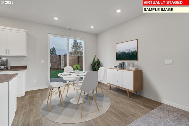 dining room with light hardwood / wood-style floors