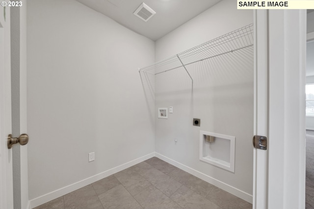 washroom featuring gas dryer hookup, hookup for an electric dryer, and washer hookup