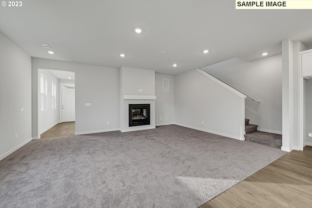 unfurnished living room featuring light wood-type flooring