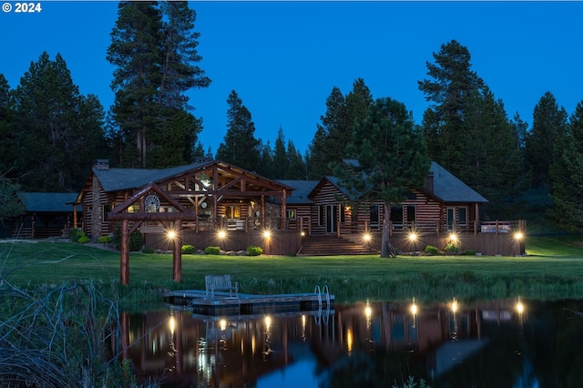 back house at night with a yard