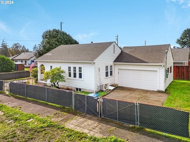 single story home featuring a garage and ac unit