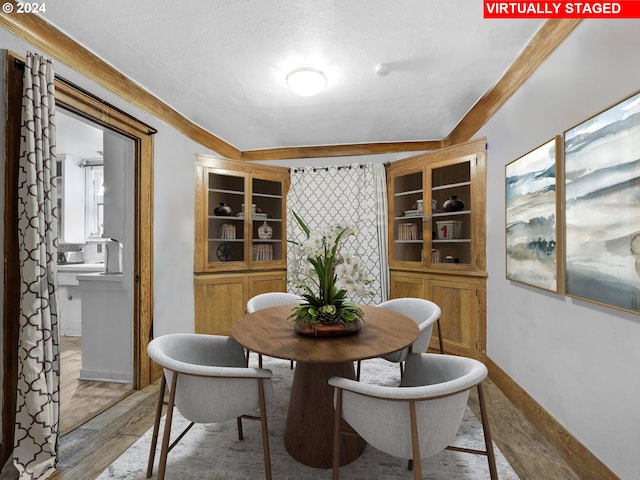 616 Park Ave, Tillamook, OR 97141 - dining area with baseboards, light wood-style flooring, and a textured ceiling