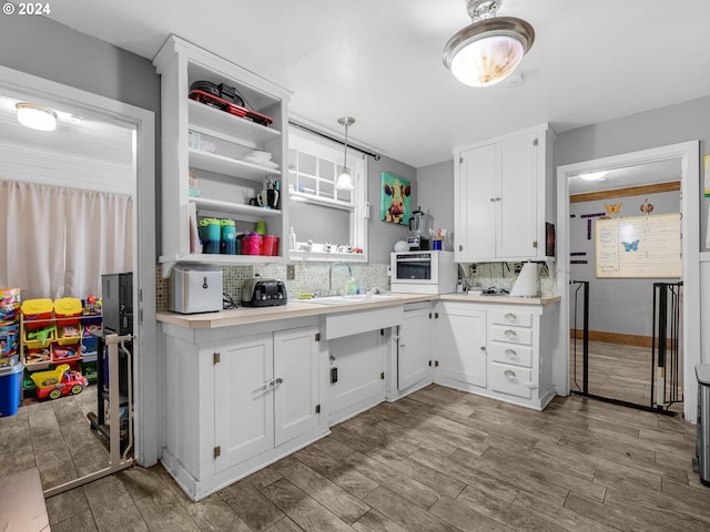616 Park Ave, Tillamook, OR 97141 - kitchen with a sink, tasteful backsplash, open shelves, light countertops, and white cabinets