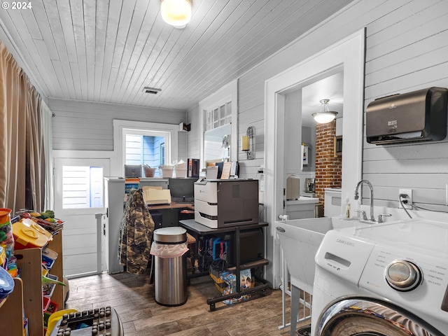 clothes washing area with wood walls, wood ceiling, dark hardwood / wood-style floors, and washer / dryer