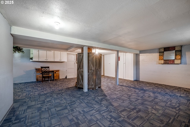 616 Park Ave, Tillamook, OR 97141 - finished below grade area featuring a textured ceiling and dark carpet