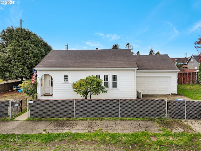 back of house with a garage