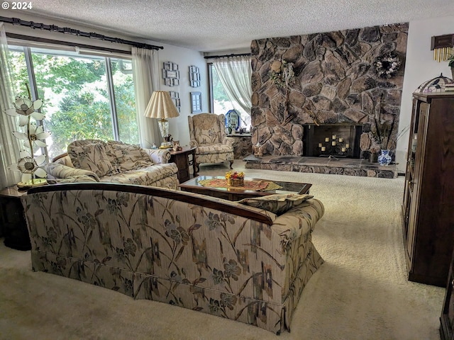 living area featuring a fireplace, a textured ceiling, and carpet floors