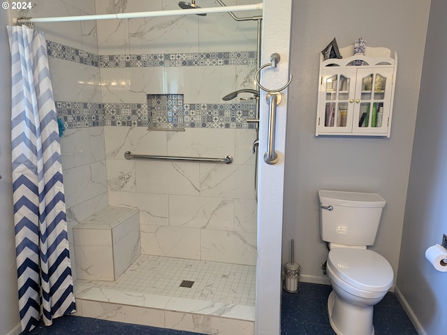 bathroom with toilet and a shower with shower curtain