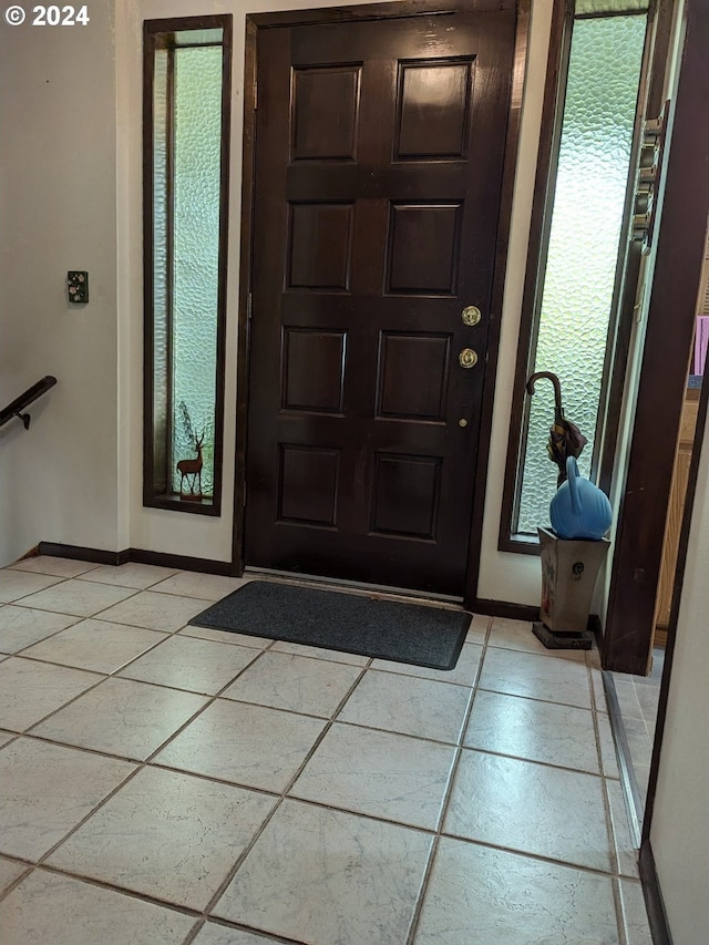 entryway featuring light tile patterned floors