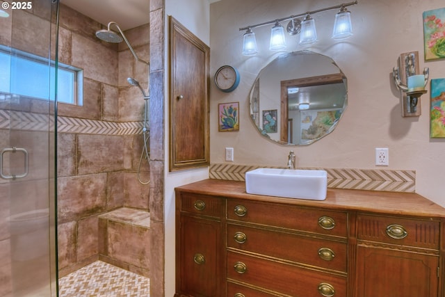 bathroom with vanity and an enclosed shower