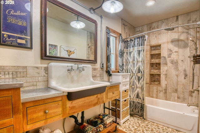 bathroom featuring vanity and shower / bath combo