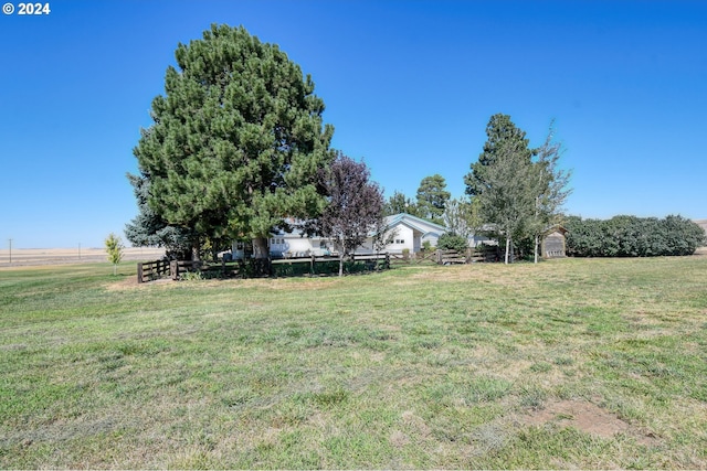 view of yard with a rural view