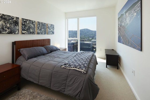 bedroom with a mountain view and carpet