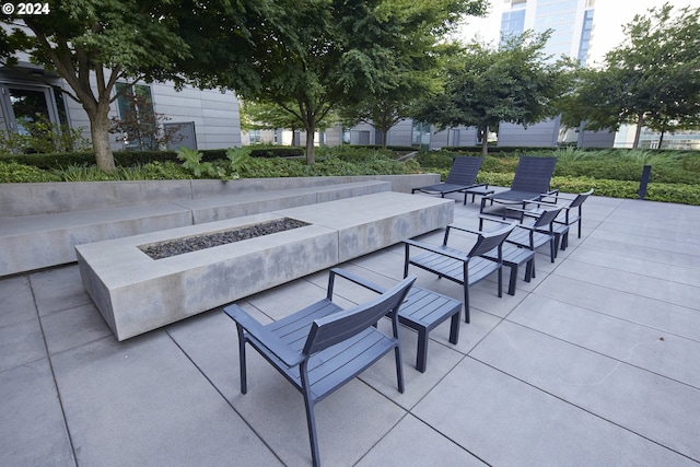 view of patio / terrace featuring an outdoor fire pit