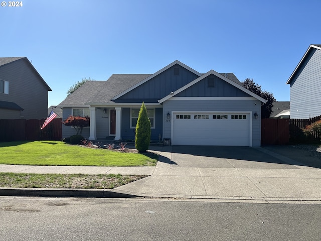 view of front facade featuring a garage and a front yard