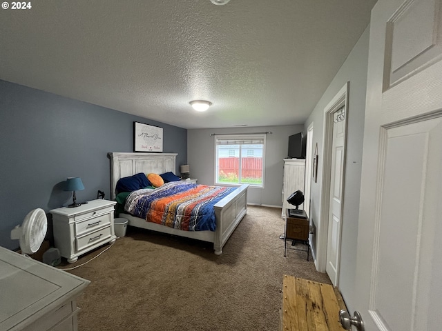 carpeted bedroom with a textured ceiling