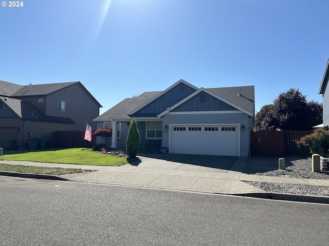 view of front facade featuring a front yard and a garage