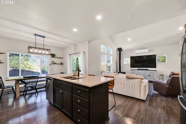 kitchen featuring pendant lighting, sink, an island with sink, dark hardwood / wood-style flooring, and stainless steel dishwasher