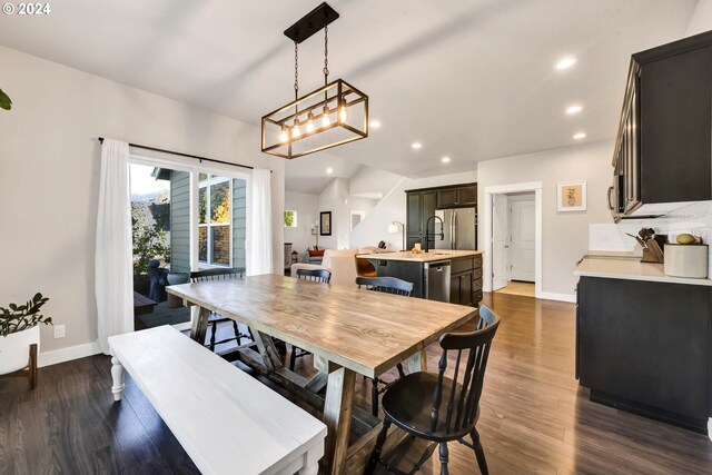 dining space featuring dark hardwood / wood-style flooring and sink