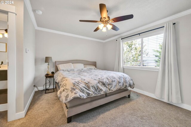 carpeted bedroom featuring ornamental molding and ceiling fan