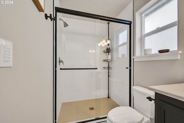 bathroom with baseboard heating, vanity, toilet, and an enclosed shower