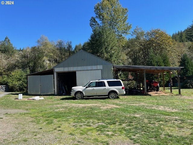 view of outbuilding with a yard