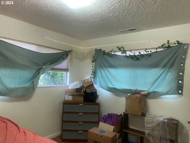 bedroom with a textured ceiling