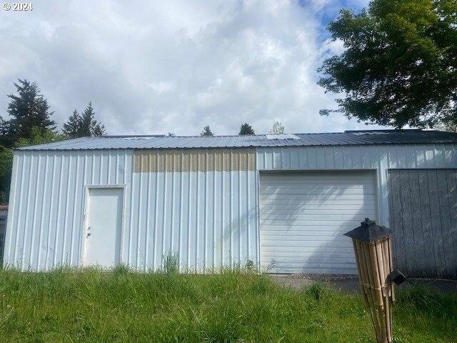 view of outbuilding featuring a garage