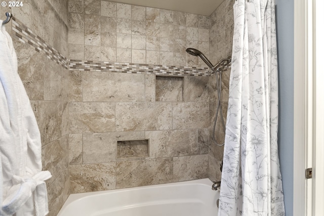 bathroom with shower / bath combo