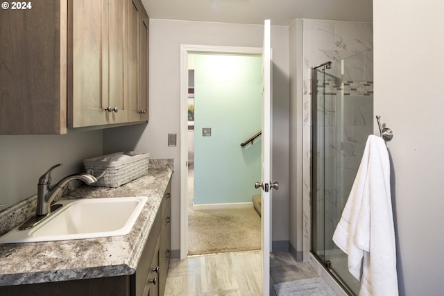 bathroom with vanity and an enclosed shower