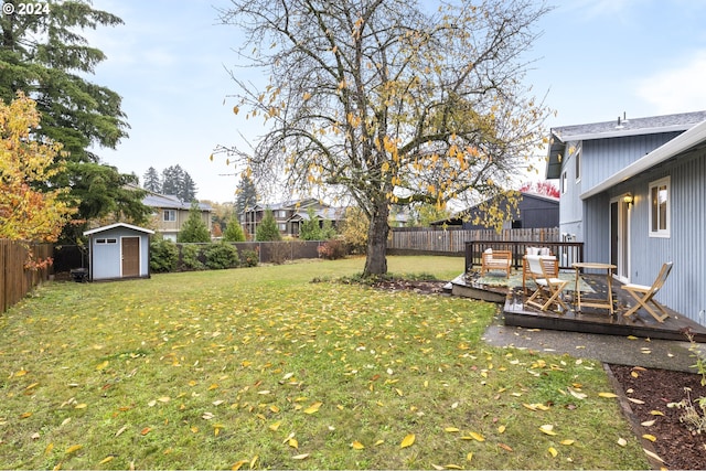 view of yard with a shed and a deck