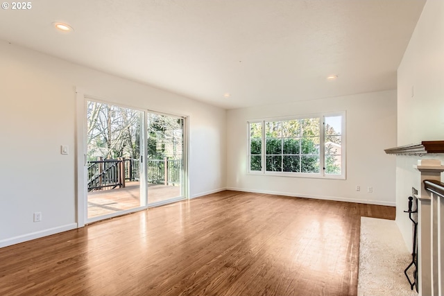 unfurnished living room featuring hardwood / wood-style floors