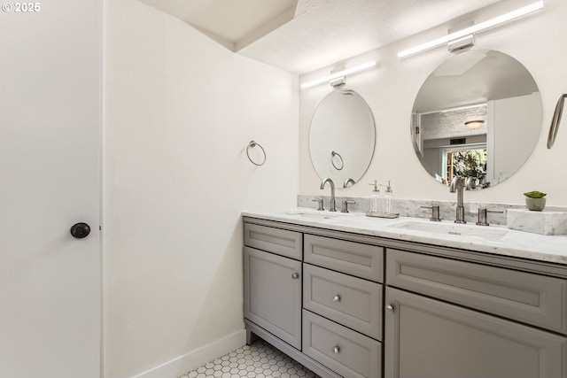 bathroom featuring tile patterned floors and vanity