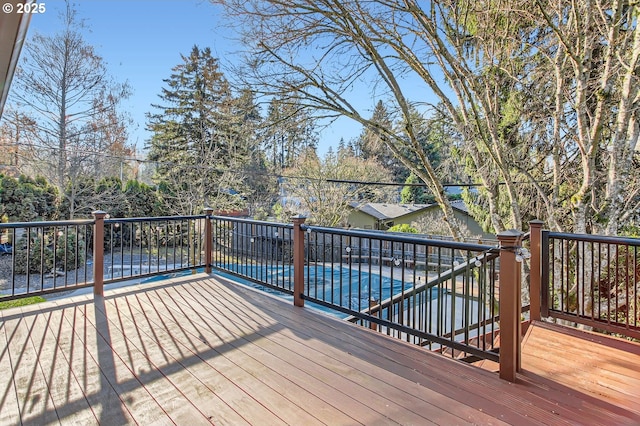 wooden terrace with a covered pool