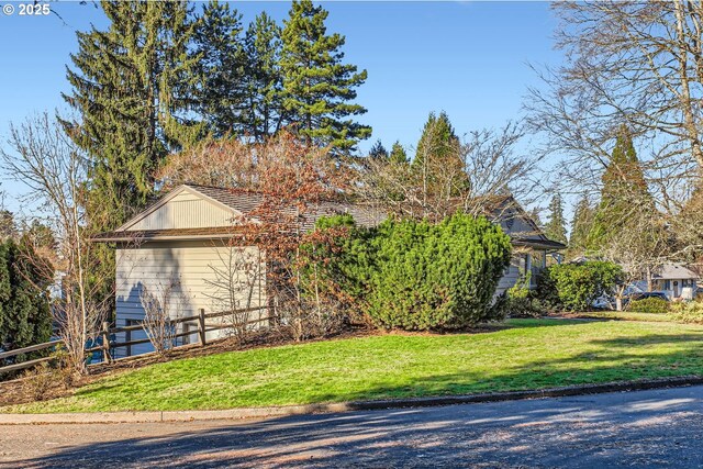 view of home's exterior with a yard